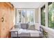 Bright, cozy living room with large windows and a sliding barn door at 1372 Gaylord St # 4, Denver, CO 80206
