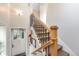 Staircase with wood and wrought iron railing leading up from the foyer at 1372 Gaylord St # 4, Denver, CO 80206