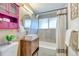 Modern bathroom with stylish vanity, contemporary sink, and a shower/tub combination at 2370 S Meade St, Denver, CO 80219