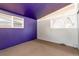Empty room with purple accent wall and neutral carpeting, ready for personalization at 2370 S Meade St, Denver, CO 80219