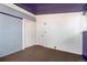 Neutral bedroom with a walk-in closet and a textured carpet, offering ample storage at 2370 S Meade St, Denver, CO 80219