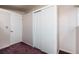 Neutral bedroom featuring an interior door and closet space for storage at 2370 S Meade St, Denver, CO 80219
