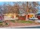 Charming single-story home with a well-maintained front yard and a classic car in the driveway at 2370 S Meade St, Denver, CO 80219