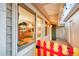 View through a backyard window showcasing the spacious kitchen and living room of a home at 2370 S Meade St, Denver, CO 80219