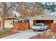 Charming home with a classic car parked out front, surrounded by mature trees and landscaping at 2370 S Meade St, Denver, CO 80219
