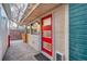 Entrance with a vibrant red door, offering a warm welcome and a pop of color to the exterior at 2370 S Meade St, Denver, CO 80219