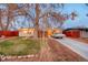 Well-maintained single-Gathering home with a spacious front yard and a classic car parked in the driveway at 2370 S Meade St, Denver, CO 80219