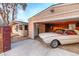 Garage featuring a vintage car, showcasing the home's quirky character and inviting appeal at 2370 S Meade St, Denver, CO 80219