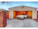 Garage of home with a vintage car visible inside, a unique feature of this well-maintained property at 2370 S Meade St, Denver, CO 80219