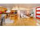 Bright, open-concept living space featuring a modern kitchen and inviting seating area at 2370 S Meade St, Denver, CO 80219