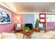 Living room with a brick fireplace, comfortable seating, and a stylish aesthetic, creating a cozy ambiance at 2370 S Meade St, Denver, CO 80219