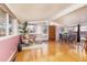 Bright and inviting living room boasts wood floors and large windows with a view of the front yard at 2370 S Meade St, Denver, CO 80219