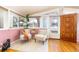 Cozy sunroom filled with natural light, featuring comfortable seating and a charming atmosphere at 2370 S Meade St, Denver, CO 80219