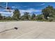 Outdoor concrete basketball court featuring multiple hoops and well-maintained surroundings at 480 S Marion Pkwy # 1601, Denver, CO 80209