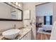 Bathroom with granite countertop and bowl sink with bedroom in background at 480 S Marion Pkwy # 1601, Denver, CO 80209