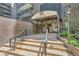 Inviting entrance to The Park Lane building with awning and well-maintained landscaping at 480 S Marion Pkwy # 1601, Denver, CO 80209