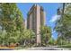 Exterior shot of a tall apartment building, captured from street level, showcasing the building's height at 480 S Marion Pkwy # 1601, Denver, CO 80209