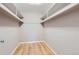 Walk-in closet with hardwood floors and white shelving at 480 S Marion Pkwy # 1601, Denver, CO 80209