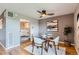 Dining area featuring a glass table and stylish decor with kitchen view at 480 S Marion Pkwy # 1601, Denver, CO 80209