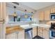 Open kitchen design with stainless steel appliances and pendant lighting at 480 S Marion Pkwy # 1601, Denver, CO 80209