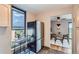 Kitchen with modern appliances, wood cabinets and a view of dining area at 480 S Marion Pkwy # 1601, Denver, CO 80209