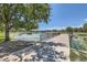 Scenic view of a wooden pier extending into a serene lake, framed by lush greenery and clear blue skies at 480 S Marion Pkwy # 1601, Denver, CO 80209