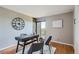 Home office with balcony, wood floors, large clock and contemporary furnishings at 480 S Marion Pkwy # 1601, Denver, CO 80209