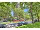 Picturesque street view of the building lined with mature trees, showcasing the building in its surroundings at 480 S Marion Pkwy # 1601, Denver, CO 80209
