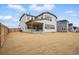 The backyard of this home features ample space and a covered patio, perfect for outdoor gatherings at 16890 Black Rose Pl, Parker, CO 80134