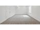 Bright basement with neutral carpet and a window providing natural light at 16890 Black Rose Pl, Parker, CO 80134