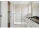Bathroom featuring a walk-in shower with glass doors at 16890 Black Rose Pl, Parker, CO 80134