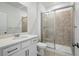 Bathroom with shower, neutral tile and white vanity at 16890 Black Rose Pl, Parker, CO 80134