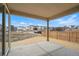 A covered patio space offering serene views of the surrounding neighborhood at 16890 Black Rose Pl, Parker, CO 80134