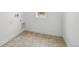 Functional laundry room with tile flooring, window, and washer/dryer hookups at 16890 Black Rose Pl, Parker, CO 80134