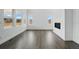 Bright living room features high ceilings, large windows, luxury vinyl plank flooring, and a modern fireplace at 16890 Black Rose Pl, Parker, CO 80134