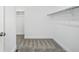 A basic walk-in closet with neutral-colored carpet and shelving at 16890 Black Rose Pl, Parker, CO 80134