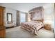 Main bedroom with canopy bed and large windows at 3445 S Ammons St # 15-4, Lakewood, CO 80227