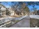 Exterior view of townhouses with snow-covered landscaping at 3445 S Ammons St # 15-4, Lakewood, CO 80227