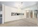 Bright dining room with a mirrored wall and chandelier at 3445 S Ammons St # 15-4, Lakewood, CO 80227