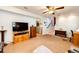 Large basement area features a ceiling fan and an open area with neutral colored walls and carpet at 862 Centennial Way, Bennett, CO 80102