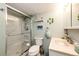 Functional bathroom showcasing a glass-enclosed shower and vanity with a modern sink at 862 Centennial Way, Bennett, CO 80102