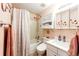 Clean bathroom featuring a shower-tub combo and sink and medicine cabinet at 862 Centennial Way, Bennett, CO 80102