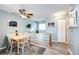 Cozy dining area with tile and glass partition and light colored walls that gives off a charming and bright atmosphere at 862 Centennial Way, Bennett, CO 80102