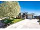 Inviting home with a spacious driveway, well-kept lawn, and blossoming trees at 862 Centennial Way, Bennett, CO 80102
