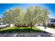 Well-manicured front yard with blooming trees adding curb appeal to this suburban home at 862 Centennial Way, Bennett, CO 80102