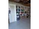 Organized garage storage with ample shelving, maximizing space and functionality for tools and equipment at 862 Centennial Way, Bennett, CO 80102