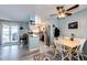 Cozy eat-in kitchen offers stainless steel appliances, light colored cabinets, and an adjacent dining area with open views at 862 Centennial Way, Bennett, CO 80102