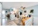 Open kitchen and dining area with modern flooring, a ceiling fan, and stairs at 862 Centennial Way, Bennett, CO 80102