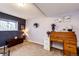 Charming office with an antique roll-top desk, perfect for a home workspace at 862 Centennial Way, Bennett, CO 80102