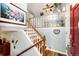 Bright stairway with glass block feature and an entry way, providing a unique architectural touch at 862 Centennial Way, Bennett, CO 80102